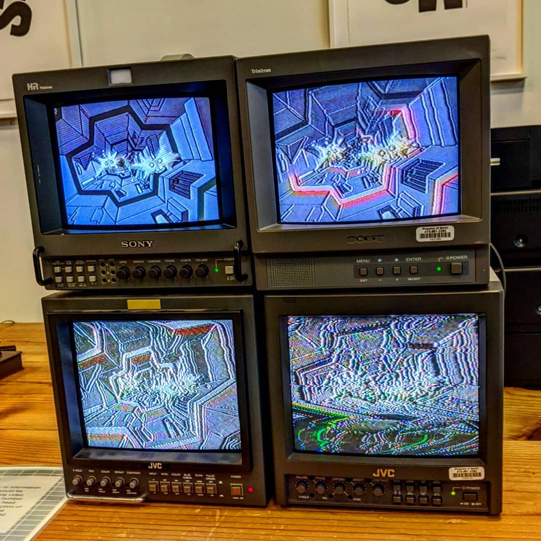 four monitors showing vhs generation loss